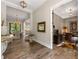 Beautiful entryway with hardwood floors and views into the dining room and office space at 131 Forsyth Park Ln, Woodstock, GA 30188