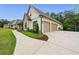 Spacious three-car garage offering ample parking and storage, with a convenient driveway and lush landscaping at 131 Forsyth Park Ln, Woodstock, GA 30188