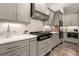 Stylish kitchen featuring custom cabinets, modern appliances, and ample counter space for cooking and entertaining at 131 Forsyth Park Ln, Woodstock, GA 30188