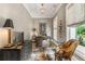Cozy home office featuring a leather chair, stylish decor, and ample natural light, ideal for remote work at 131 Forsyth Park Ln, Woodstock, GA 30188