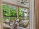 Relaxing porch with comfortable seating and views of the lush surrounding greenery at 131 Forsyth Park Ln, Woodstock, GA 30188