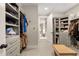 Spacious walk-in closet with custom shelving and storage units at 131 Forsyth Park Ln, Woodstock, GA 30188