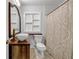 Bathroom featuring vessel sink, wood vanity, patterned shower curtain, and recessed shelving at 1747 Parkhill Dr, Decatur, GA 30032