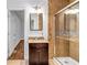 Modern bathroom with walk-in shower, custom vanity, and tiled floors at 1747 Parkhill Dr, Decatur, GA 30032