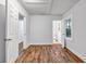 Cozy bedroom features beautiful wood-look floors, neutral walls, and bright window light at 1747 Parkhill Dr, Decatur, GA 30032