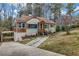 Charming craftsman home with a landscaped front yard, carport, and a welcoming entrance at 1747 Parkhill Dr, Decatur, GA 30032