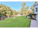 The spacious backyard is fully fenced in with lush green grass at 2203 Arbor Hill Rd, Canton, GA 30115
