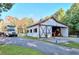 A well-maintained barn with a large sliding door and adjacent horse trailer at 2203 Arbor Hill Rd, Canton, GA 30115