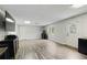 Finished basement with light gray floors and natural light at 2203 Arbor Hill Rd, Canton, GA 30115