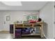 Spacious basement area featuring a large table, lighting, and laminate floors at 2203 Arbor Hill Rd, Canton, GA 30115