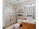 Bathroom with a shower/tub combo, toilet, vanity, and a mirrored medicine cabinet at 2203 Arbor Hill Rd, Canton, GA 30115