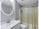 Bathroom featuring a single vanity, toilet, and a shower/tub combination at 2203 Arbor Hill Rd, Canton, GA 30115