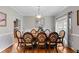Formal dining room with an ornate table, decorative chairs, and natural light at 2203 Arbor Hill Rd, Canton, GA 30115