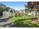 Beautiful home featuring a well-manicured lawn, mature trees, and a spacious driveway leading to the garage at 2203 Arbor Hill Rd, Canton, GA 30115