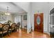 Elegant foyer with hardwood floors, a decorative front door, and view of dining room at 2203 Arbor Hill Rd, Canton, GA 30115