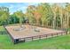 Fenced equestrian arena featuring various jumps and natural surroundings at 2203 Arbor Hill Rd, Canton, GA 30115