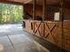 Horse stall with wooden door, metal grate, and horse at 2203 Arbor Hill Rd, Canton, GA 30115