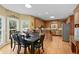 Eat-in kitchen area featuring wood cabinets, stainless steel appliances, and hardwood floors at 2203 Arbor Hill Rd, Canton, GA 30115
