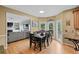 Cozy eat-in kitchen with backyard views, hardwood floors, and adjacent to living room with fireplace at 2203 Arbor Hill Rd, Canton, GA 30115