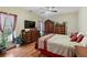 Bedroom featuring an ornate dresser, TV, and natural light at 2203 Arbor Hill Rd, Canton, GA 30115