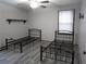 Neutral-toned bedroom featuring hard surface floors and two twin beds at 244 Hilltop Sw Dr, Atlanta, GA 30315