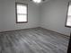 Bright bedroom featuring neutral gray walls and hard surface floors at 244 Hilltop Sw Dr, Atlanta, GA 30315