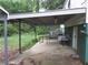 Exterior back porch featuring a covered awning over a table and chairs at 244 Hilltop Sw Dr, Atlanta, GA 30315