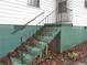 Green stairs leading to the entrance of the house at 244 Hilltop Sw Dr, Atlanta, GA 30315