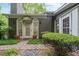 Back entrance with arched doorways and lush landscaping at 245 Scotch Pine Ct, Alpharetta, GA 30022