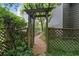 Backyard garden entry and landscaping that creates a peaceful outdoor space at 245 Scotch Pine Ct, Alpharetta, GA 30022