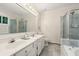 Bathroom featuring double sink vanity, large mirror, shower, and jetted tub at 245 Scotch Pine Ct, Alpharetta, GA 30022