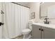 Bathroom with a vanity, mirror and shower with white curtain at 245 Scotch Pine Ct, Alpharetta, GA 30022