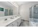Bright bathroom with a double vanity, separate shower, and marble accents at 245 Scotch Pine Ct, Alpharetta, GA 30022