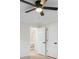 Comfortable bedroom features a ceiling fan and white doors at 245 Scotch Pine Ct, Alpharetta, GA 30022