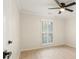 Bright bedroom with a ceiling fan and window with blinds at 245 Scotch Pine Ct, Alpharetta, GA 30022