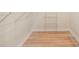 Walk-in closet featuring wood floors and wire shelving at 245 Scotch Pine Ct, Alpharetta, GA 30022