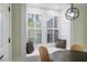 Cozy dining area featuring built-in window seat, and modern lighting at 245 Scotch Pine Ct, Alpharetta, GA 30022