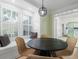 Bright dining area featuring a built-in bench, a pendant light, and views of the adjacent kitchen space at 245 Scotch Pine Ct, Alpharetta, GA 30022