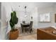 Elegant dining area with a modern chandelier and seating for six at 245 Scotch Pine Ct, Alpharetta, GA 30022