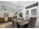 Open dining area with seating for six and french doors at 245 Scotch Pine Ct, Alpharetta, GA 30022