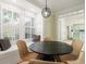 Dining room with a modern light fixture, window seat and view to the kitchen at 245 Scotch Pine Ct, Alpharetta, GA 30022