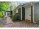 Charming home exterior featuring a stone pathway leading to the entrance at 245 Scotch Pine Ct, Alpharetta, GA 30022