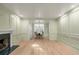 A living room with a fireplace that leads to the dining room at 245 Scotch Pine Ct, Alpharetta, GA 30022