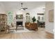 Bright living room featuring a fireplace, modern furnishings, and elegant decor at 245 Scotch Pine Ct, Alpharetta, GA 30022