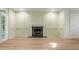 Spacious living room with fireplace and doors to the outside at 245 Scotch Pine Ct, Alpharetta, GA 30022