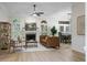 Bright living room featuring a fireplace, wood floors, and modern furniture at 245 Scotch Pine Ct, Alpharetta, GA 30022