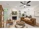 Inviting living room with fireplace, modern furniture, and a view into the dining room at 245 Scotch Pine Ct, Alpharetta, GA 30022