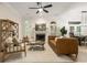 Inviting living room with fireplace, modern furniture, and a view into the dining room at 245 Scotch Pine Ct, Alpharetta, GA 30022