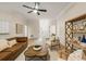 Spacious living room featuring modern decor, wood floors and wainscoting at 245 Scotch Pine Ct, Alpharetta, GA 30022