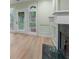Living room showcasing a fireplace with a green marble hearth and French doors leading to the outside at 245 Scotch Pine Ct, Alpharetta, GA 30022